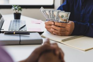 employer withholds earned bonuses